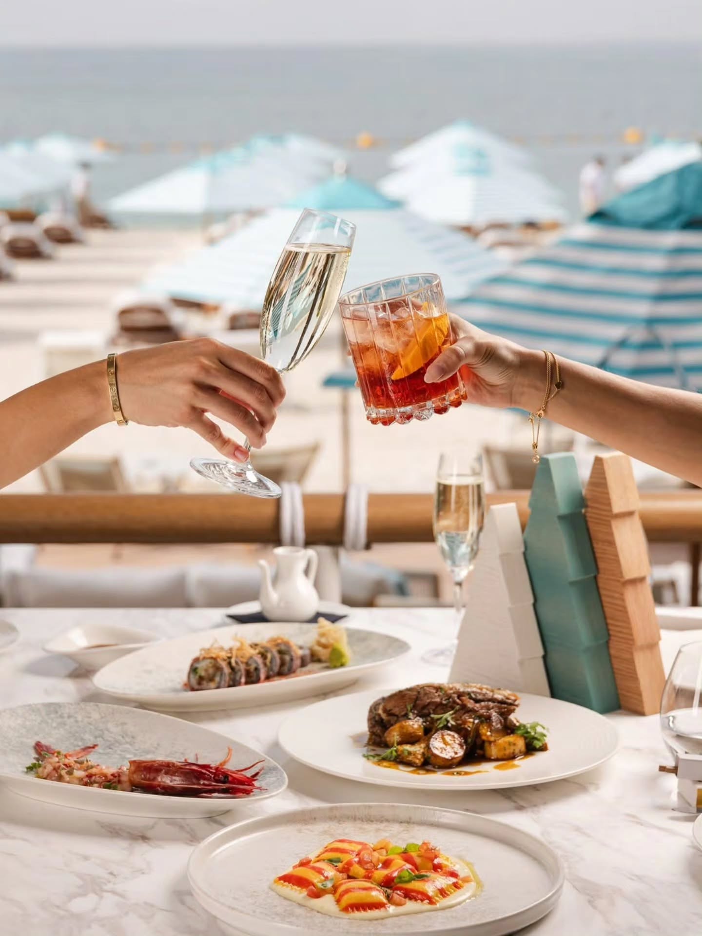 Beachside lunch with champagne and cocktails arranged for private guests