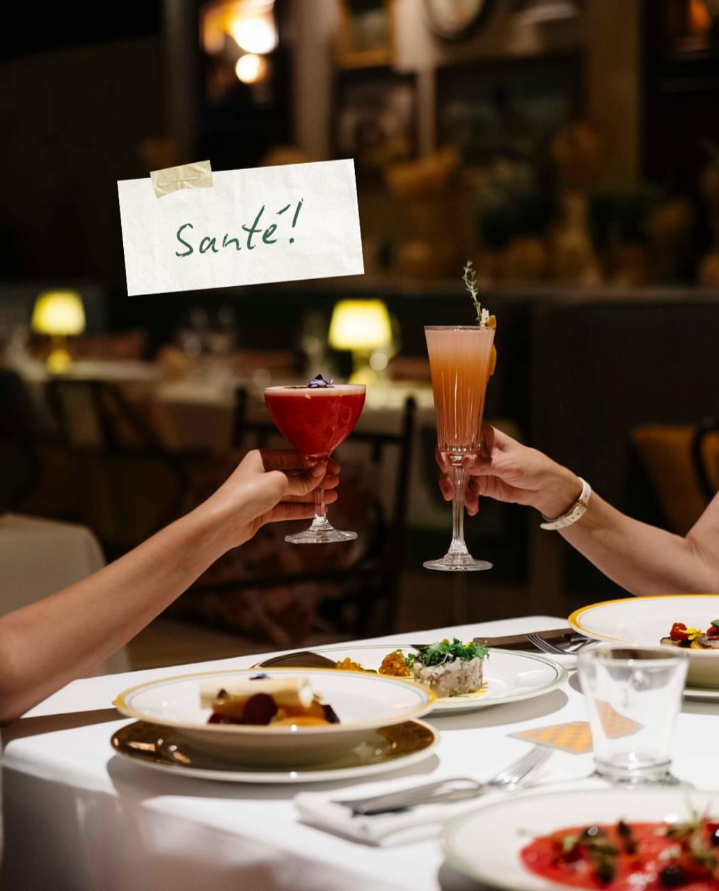 Private dining toast with cocktails at a refined Dubai table