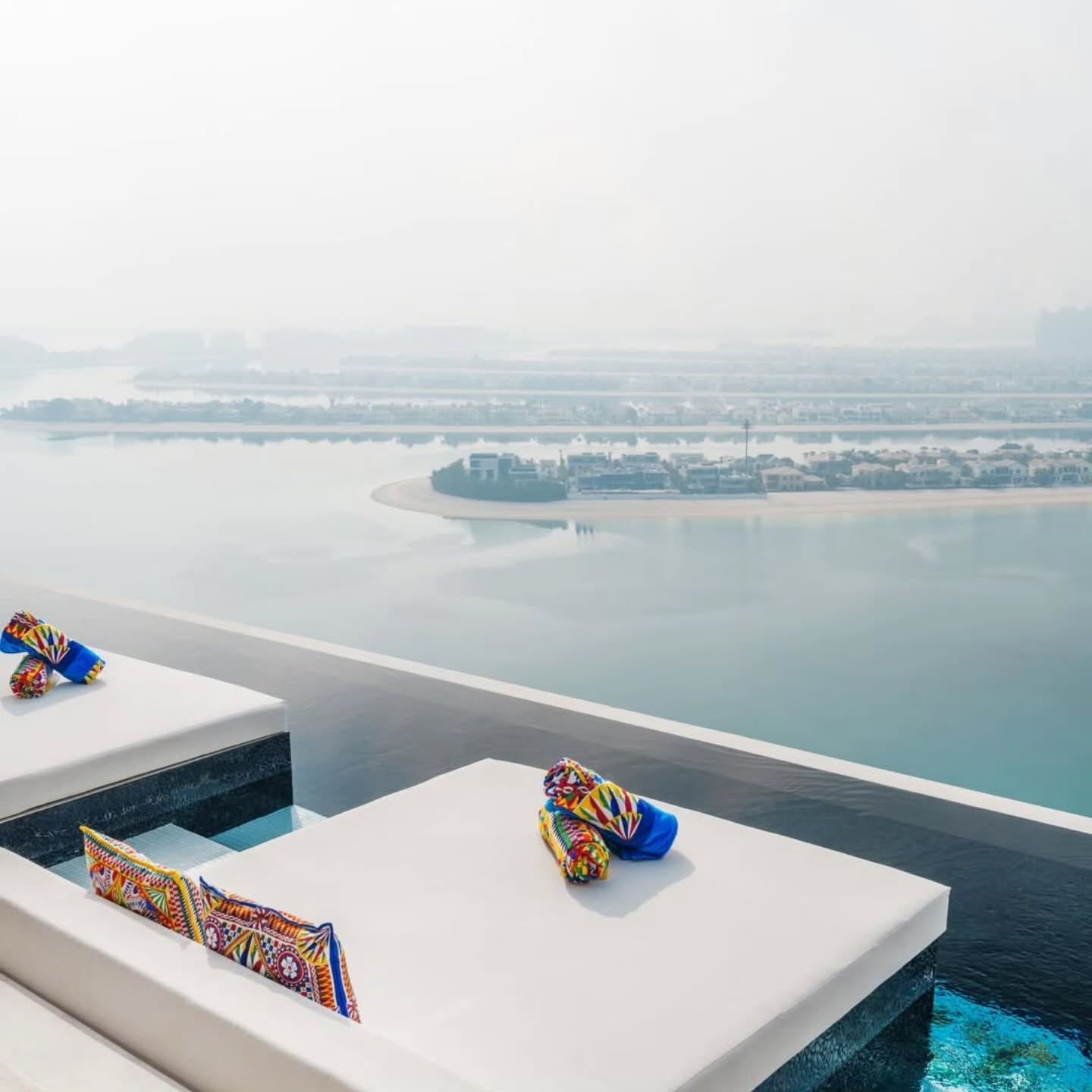 Private pool suite overlooking Dubai coastline and calm water